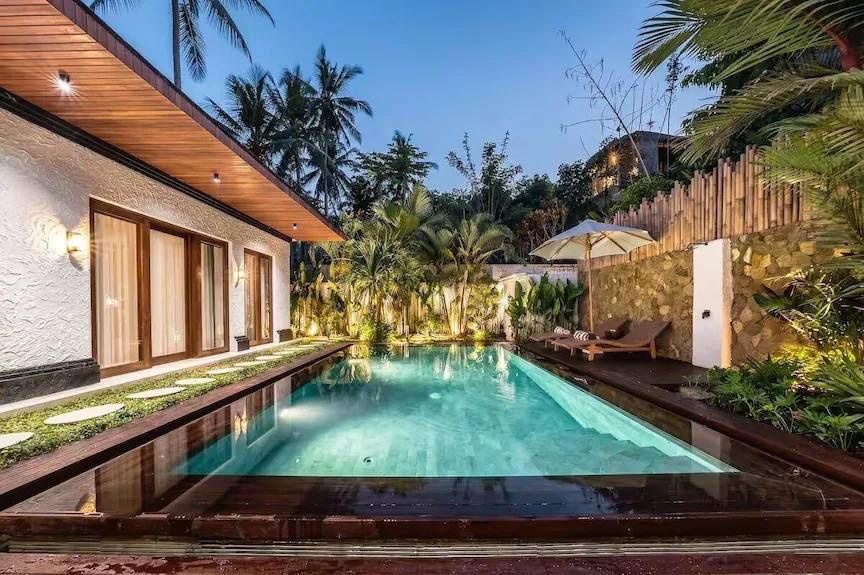 Private villa swimming pool at dusk